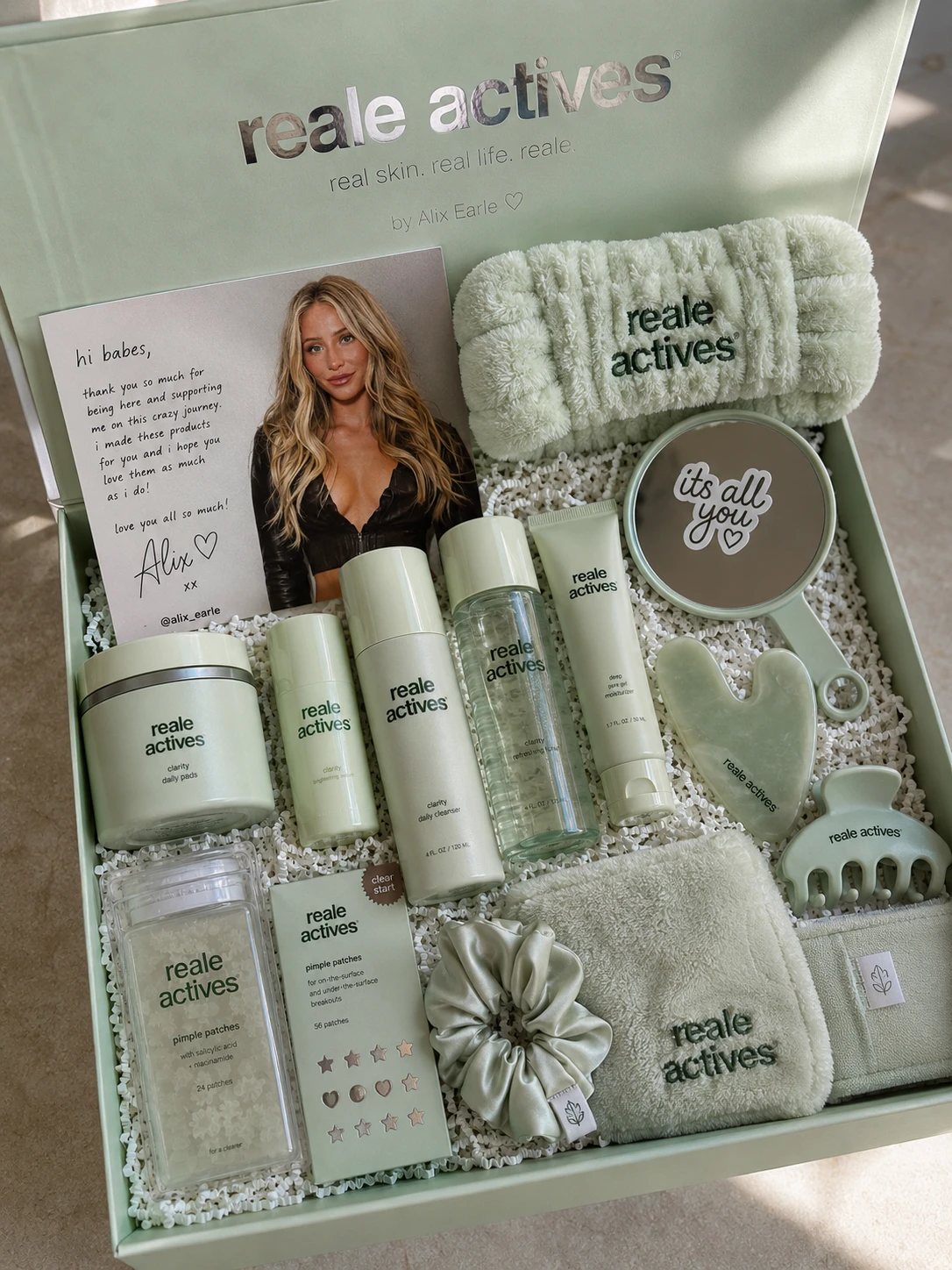 Custom skincare PR box with branded products, headband, gua sha, mirror, scrunchie and a handwritten note card