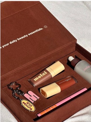 Custom beauty PR box with branded products in a suede case